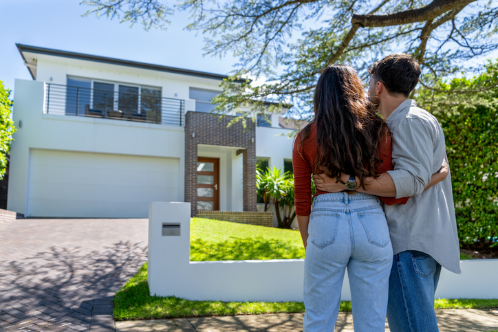 Happy couple admiring their first home in Camden